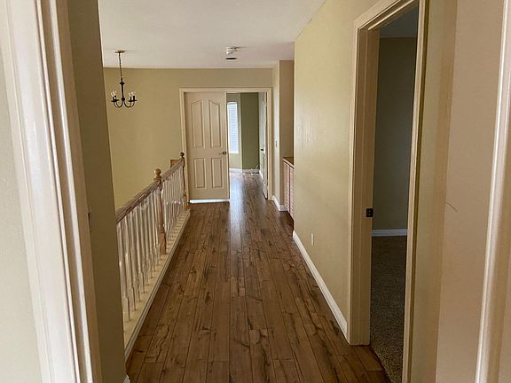 From bedroom 2 looking towards the Primary Bedroom w/double entry doors