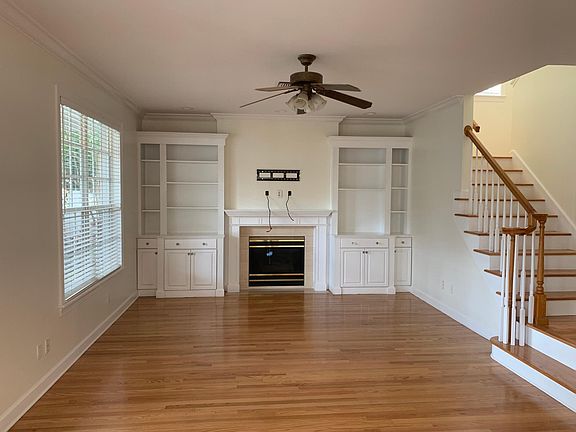 Family room with custom built bookcases and cables for large flat screen TV