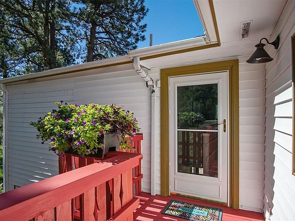 Welcoming front entry with newly painted deck