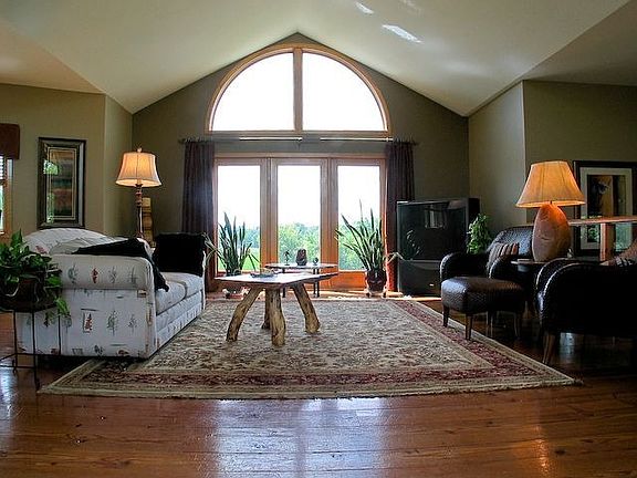 Living room with dramatic window wall and gorgeous views!