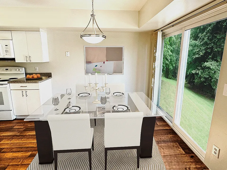 Modern white appliances and cabinetry in large well-designed kitchen