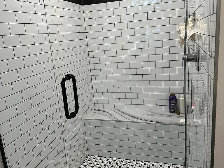 Primary suite shower with frameless glass