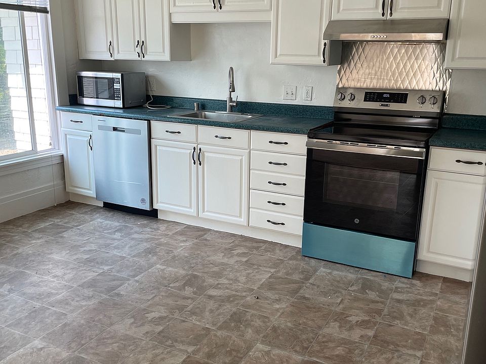 Refinished kitchen. (All cabinet pulls have been replaced since this photo was taken.)