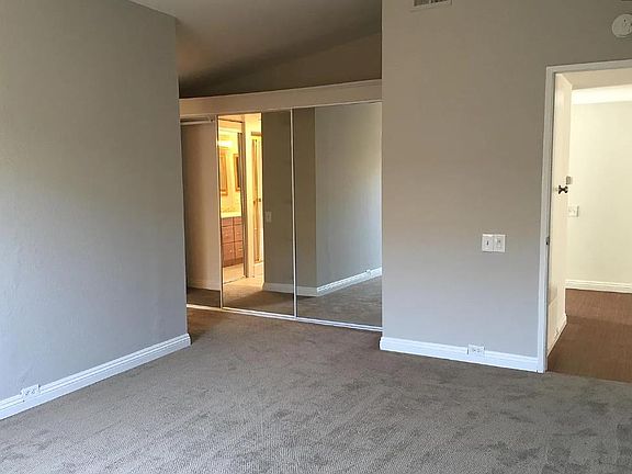 Primary bedroom suite has private bathroom with 2 sinks, shower and separate bathtub, and lots of closet space.