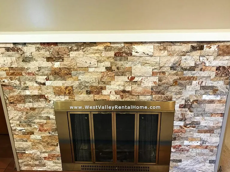 New beautiful stone front on fireplace in living room