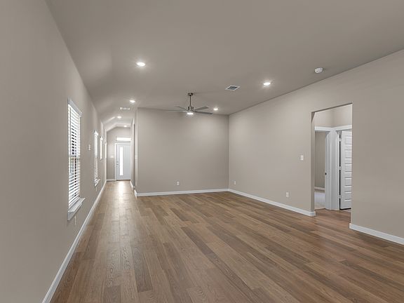 Living area, with both secondary bedroom through the doorway on the right.