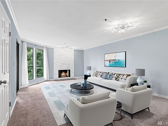 Open living room with updated light fixtures