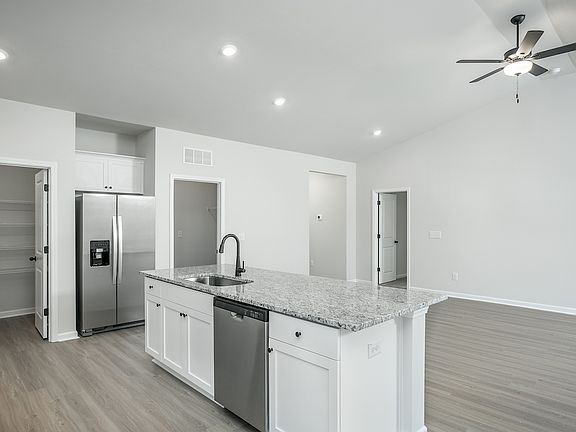 The kitchen overlooks the living area