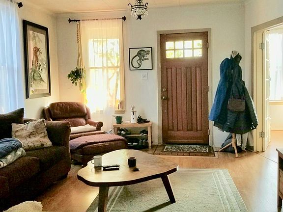 Living Room with Sun room through French doors, Hard wood floors