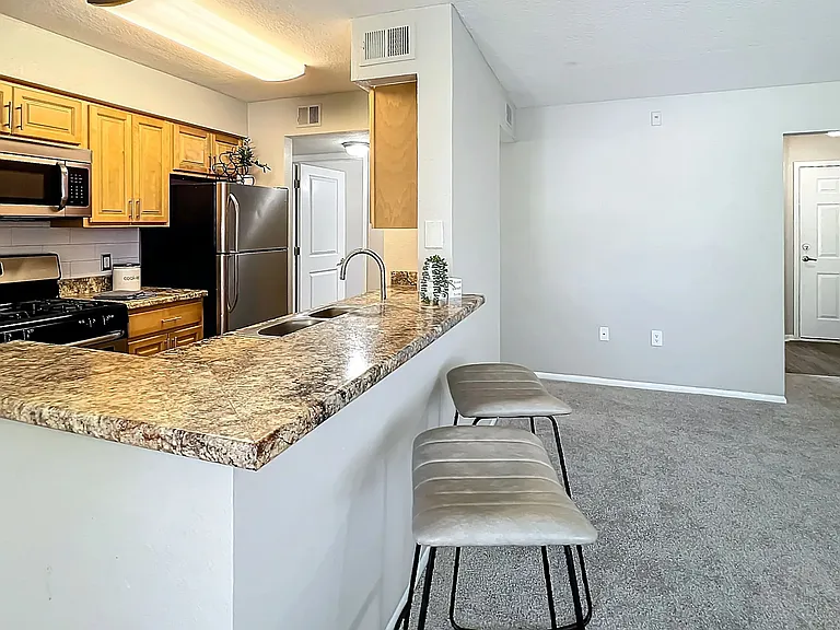 Enjoy the open layout of our spacious kitchen and breakfast bar, perfect for casual dining and entertaining guests.