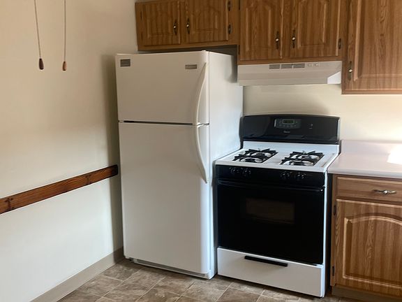 KITCHEN: Not current photo (old flooring shown)
