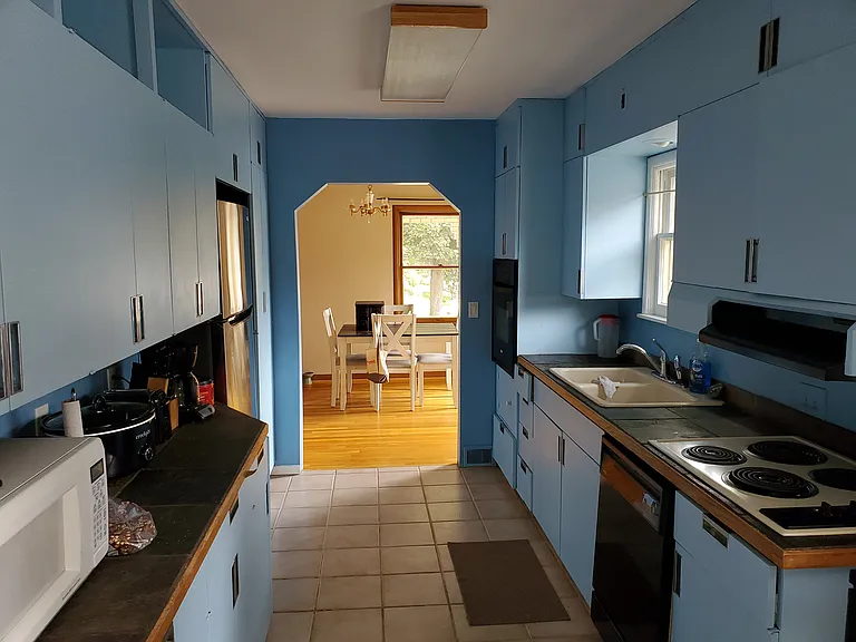 Kitchen with lots of cabinet space, two pantries.