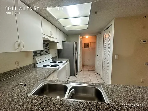 5011 Wiles Rd #3-207 Photo 1