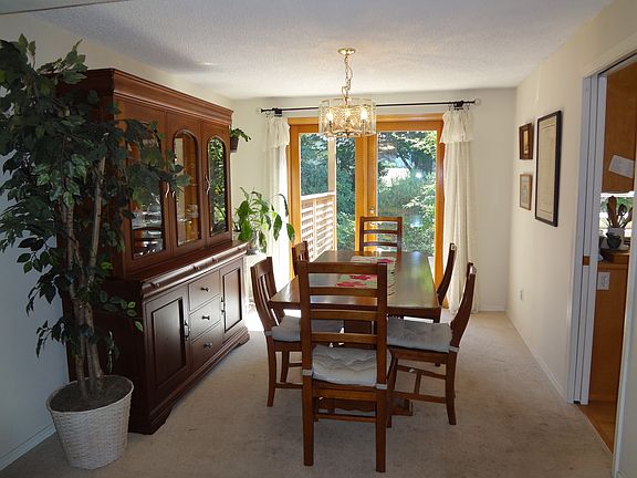 Dining area leads to deck through French doors