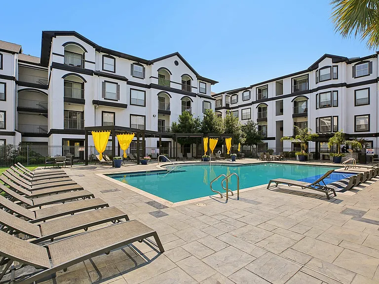 Relax and soak up the sun at Providence Uptown's luxurious resort-style pool and tanning deck in Houston, TX.