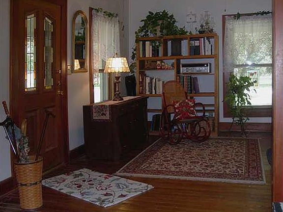 13X14 front parlor/lr with exterior stained glass front door. Original fir hdwd flrs throughout most