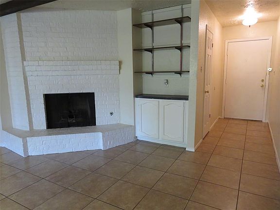 A closer look at the Wood Burning Fireplace, Built-Ins and Front Entry