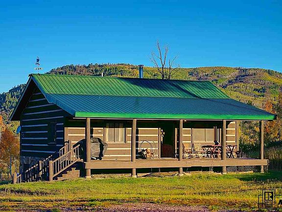 Front of cabin with full length porch