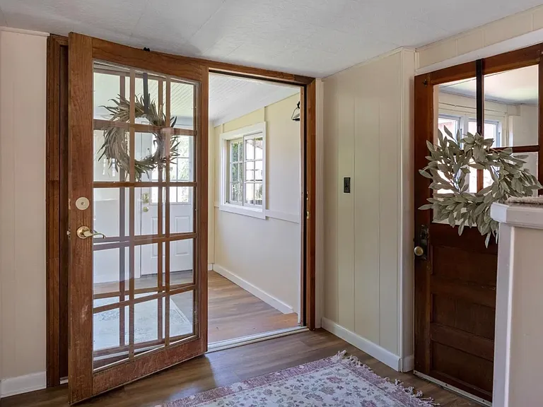 Back entrance from kitchen into laundry room (on the right) and sunroom