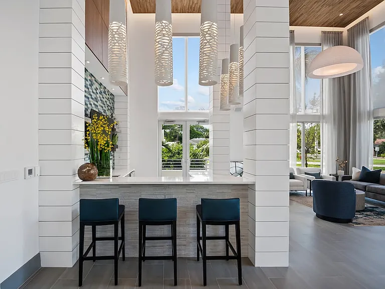 Lounge with multiple seating areas and kitchenette