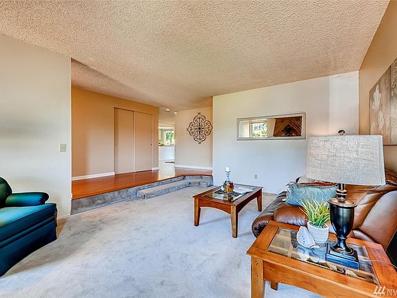 Pass the living room you will enter the dining/kitchen/family room to the left.