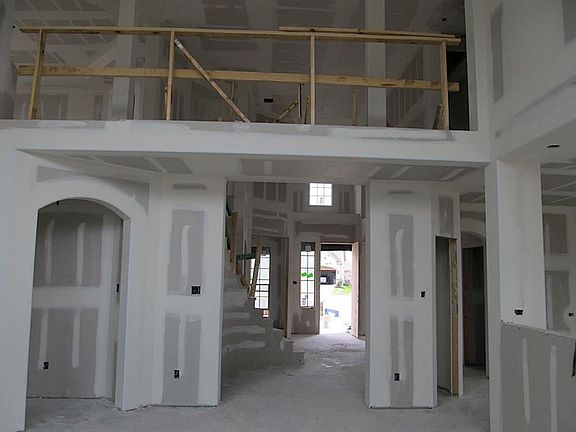 This Kitchen will feature huge 8' island island, lots of dark wood cabinetry and pendant lights above butlers pantry!