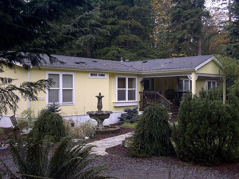 Front of house with big covered porch.
