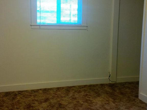 Master bedroom with remodeled attached bath.