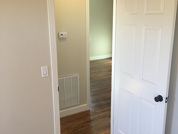 Master bedroom looking toward BR 1 through hallway.