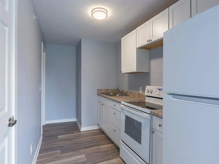 Lighting in a kitchen with grey walls.