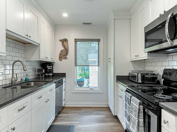 Newly renovated kitchen with stainless steel appliances.