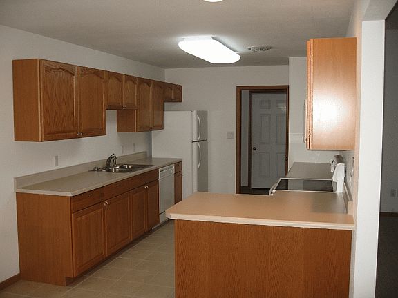 A lot of cabinet space attached to laundry room.