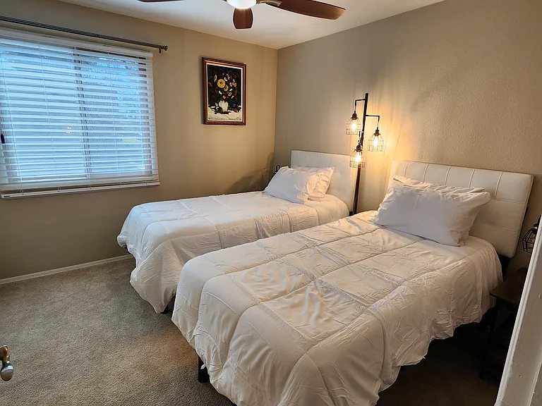 Middle bedroom 2 with two adjustable beds. May be pushed together depending on needs.