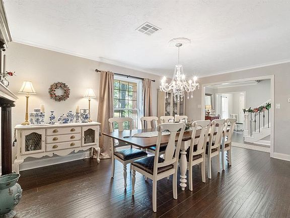 The spacious dining room is located just to the right of the entry and adjoins the open concept family room and kitchen.