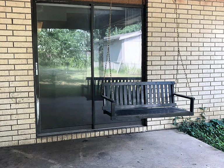 Covered private patio with swing