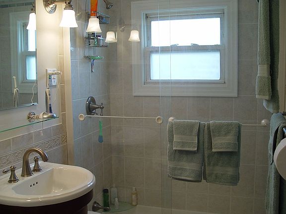 Recently renovated tiled bath