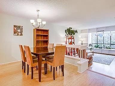 Dining room with adjace.nt sunken living room. Bamboo floors throughout unit