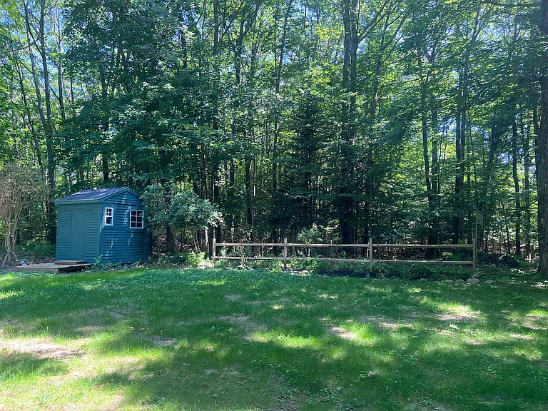 Freshly painted garden shed & mulched back plot.