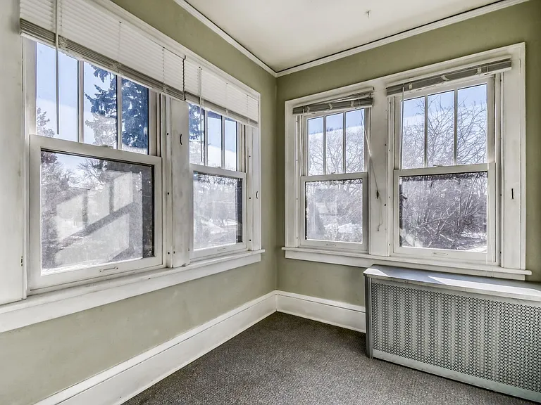 Back Sun porch. Perfect for home office. Overlooks backyard. 
Faces south - all day sun.