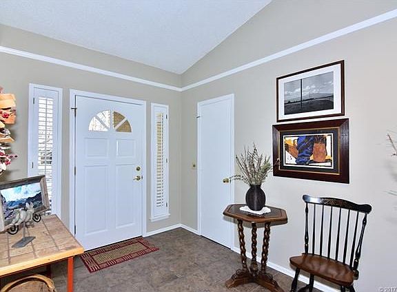 Spacious Entry, tile flooring and walk-in closet.