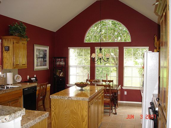 Kitchen with vaulted ceiling and granite