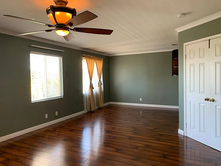 Very large master bedroom with natural light and entertainment space.