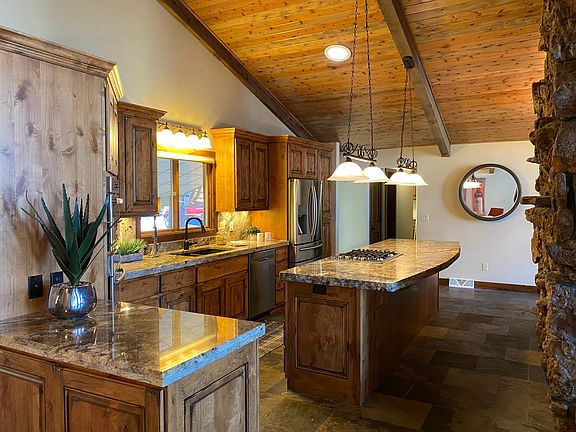 Gorgeous kitchen with gas cooktop and wine fridge.