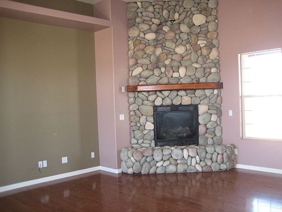 STONE FIREPLACE IN LIVING ROOM