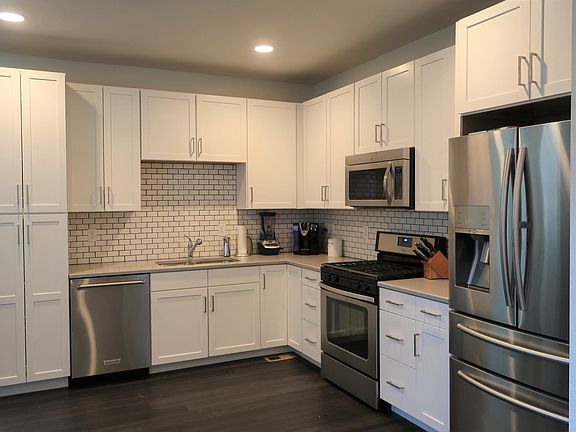 Modern Kitchen with high end stainless appliances and gas ra
