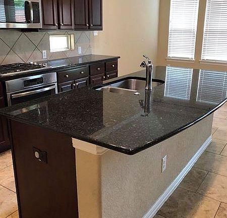 Granite counter tops, gas cook top and microwave, eat in kitchen.