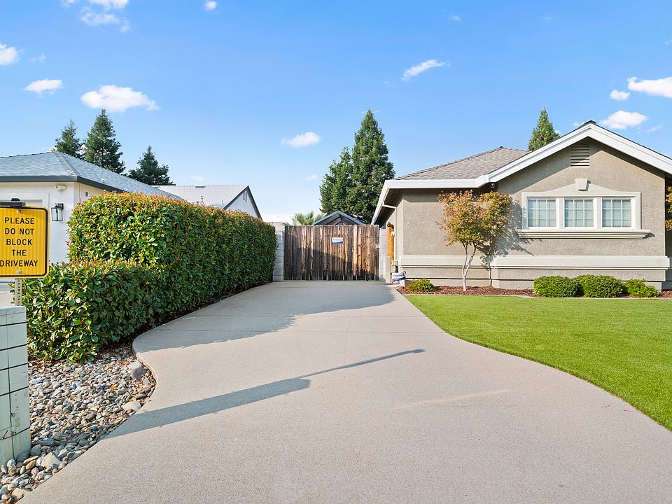 Tenant's driveway with motion detection lights and camera.