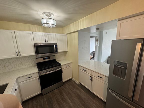 Kitchen with pass through to living room