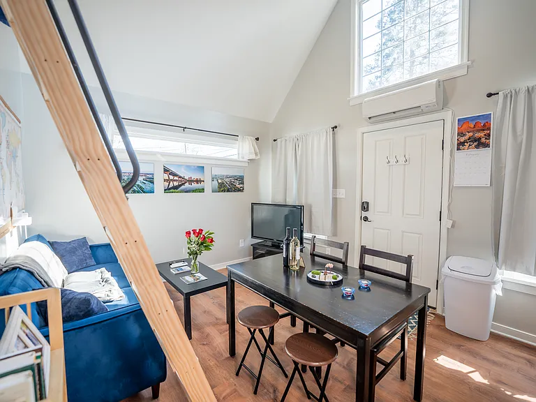 A 42-inch TV with streaming services included can be viewed from anywhere in the kitchen and living room, and your full-sized dining table provides ample space for hosting guests