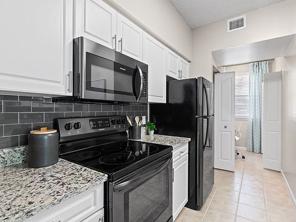 Kitchen with Stainless Steel Appliances at Verona at Boynton Beach Apartments in Boynton Beach, FL 33426